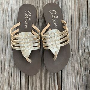 Cobian Gold leather flip flops.